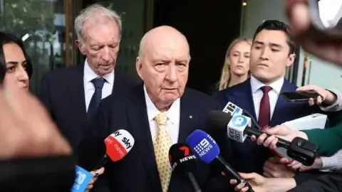 Indecent Assault Charges Against Top Aussie Broadcaster Lessened